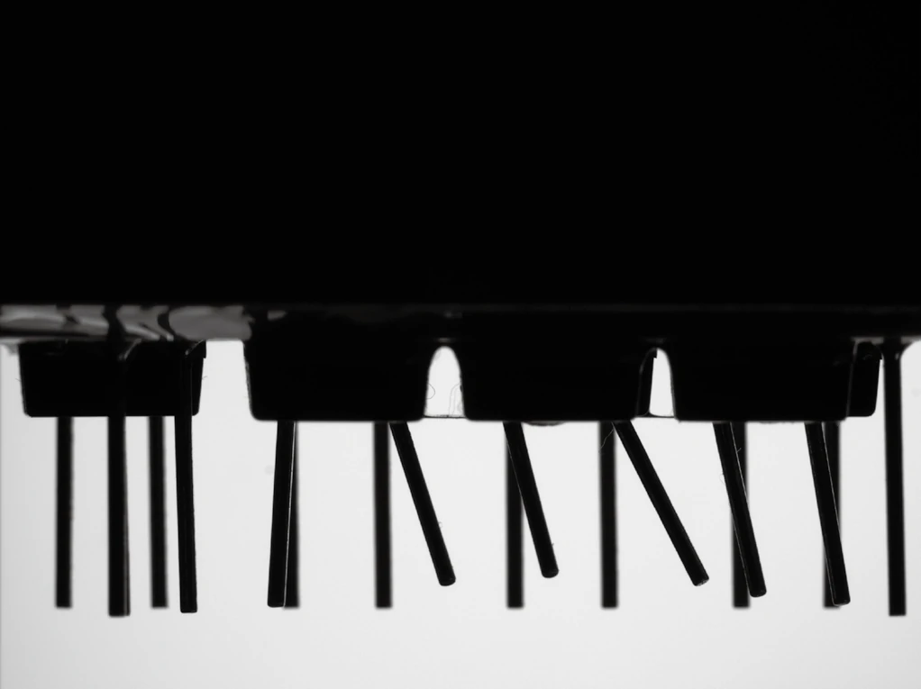 Board header pins over a backlight (LS-VCM230-120-AL): the bent pins are obvious, and every edge is measurable.