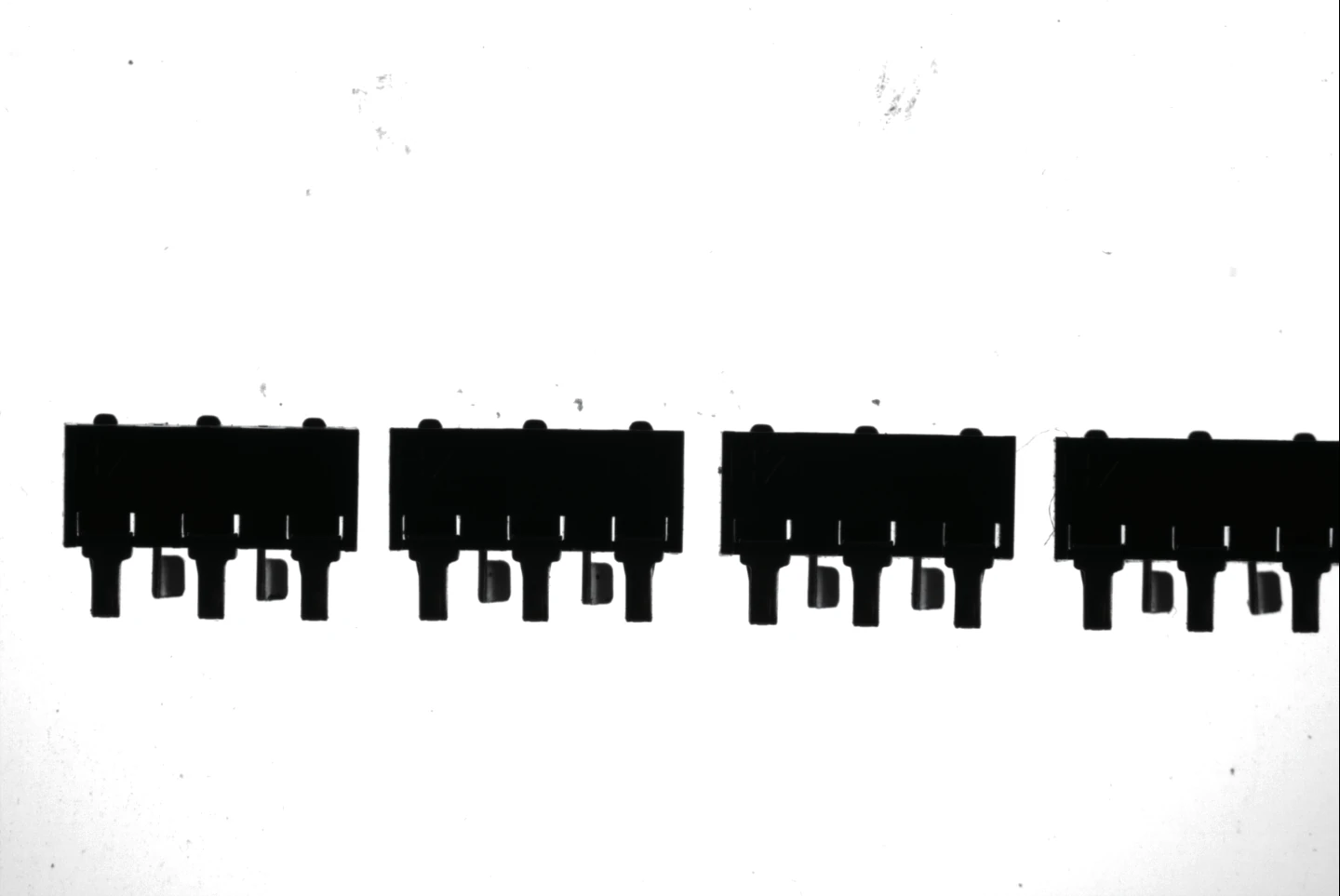 A row of connectors over a flat backlight (LS-VCM125-64-AL): high contrast with an even background across the field.