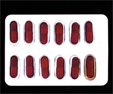 Source white flat-coaxial image: the lower-right pocket has a different surrounding colour and texture from several adjacent pockets.