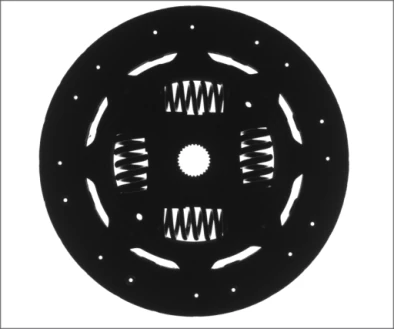 Source backlight image: a dark circular plate contains four spring-window patterns, openings and a central hole.