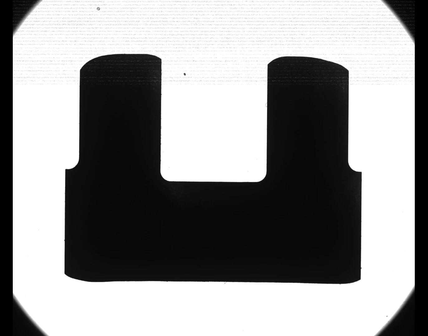 The camera capture shows a forked shaft profile with a bright slot between two dark shoulders and a clear outer contour.