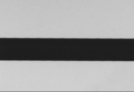 Original collimated-panel side: dimmer background and a more distinct outline boundary.