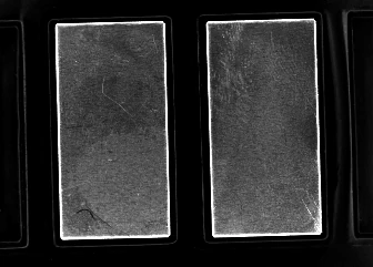 Real source capture: rectangular faces and their outlines stand out from the dark carrier.