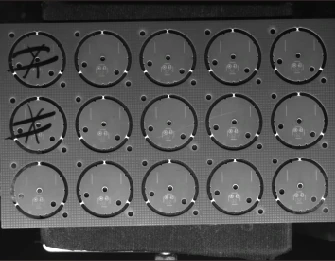 Same application sheet with the arc bar; repeated round outlines remain clearer across the field.