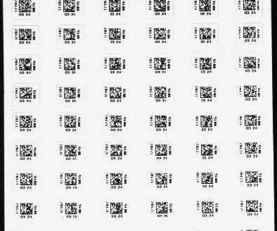 Source white-bar capture: repeated small two-dimensional marks and adjacent identifiers across a label sheet.