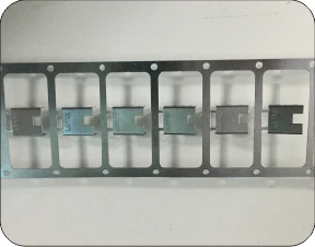 The test part: stamped shield terminals carried on a strip.
