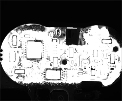 A separate board example under a UV ring; bright regions surround populated components.